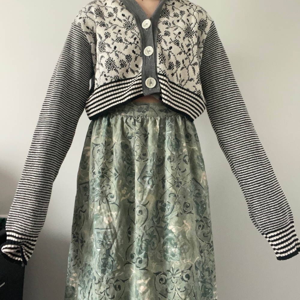 Grey cardigan. Taylor swift vibes lowkey. Cute little design on front